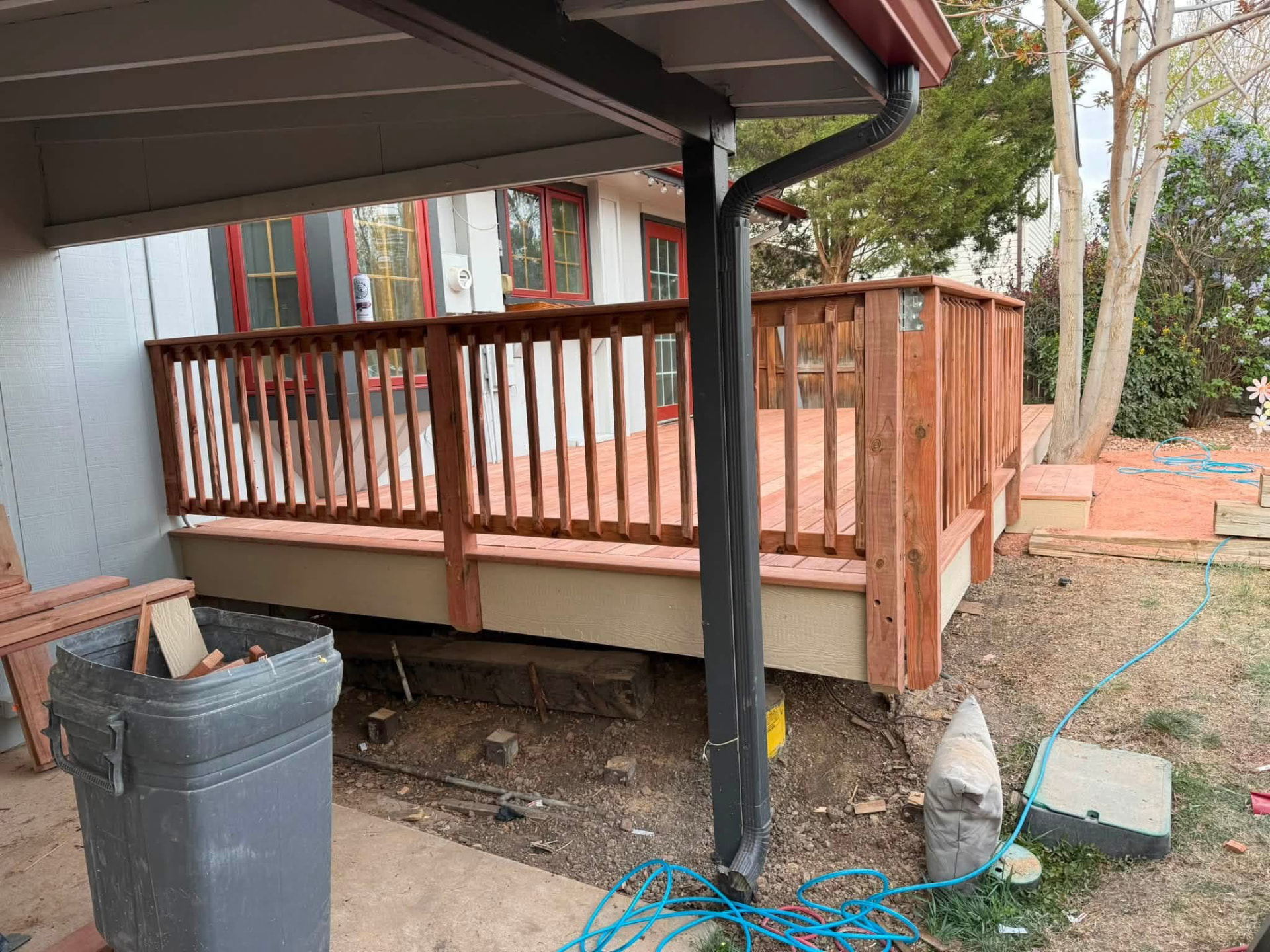 Wooden deck with new railings and balusters during construction